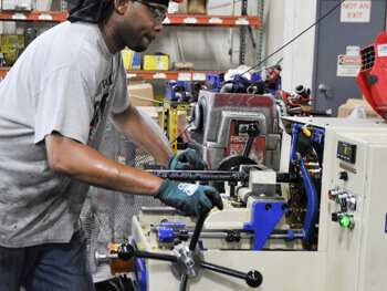 Northstar technician working on a custom fabrication project in their fully equipped fabrication shop
